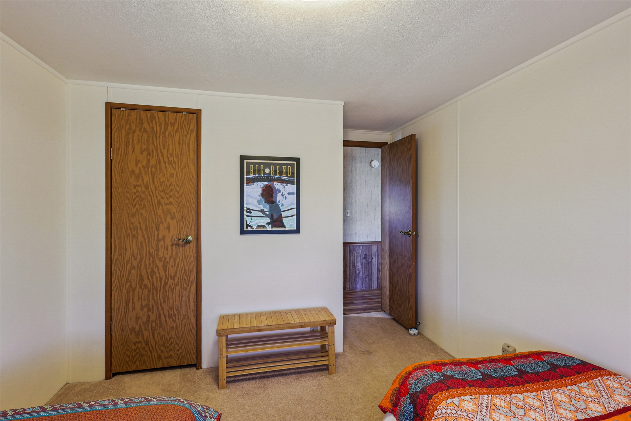 106 Ridge Line Drive Fort Davis, TX 79734 - Photo 24 of 39 a bedroom with a bed and a painting on the wall