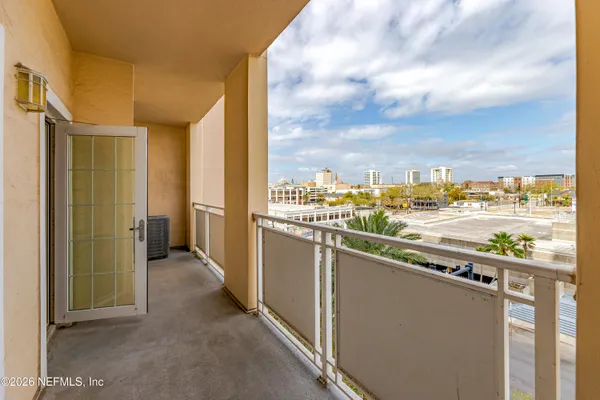a view of a balcony with city view