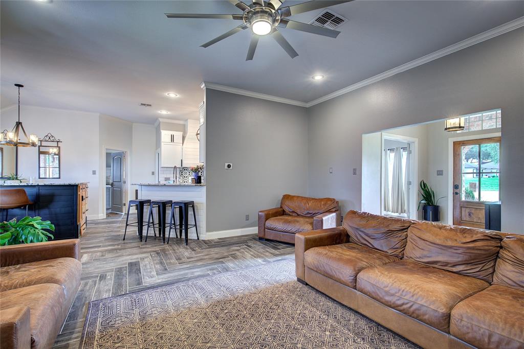 2027 Park Springs Road Sulphur Springs, TX 75482 - Photo 9 of 39 a living room with furniture and a dining table