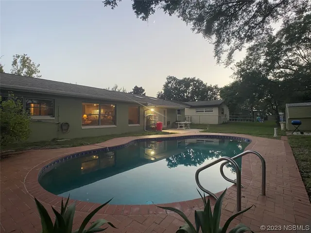 a view of swimming pool with seating space