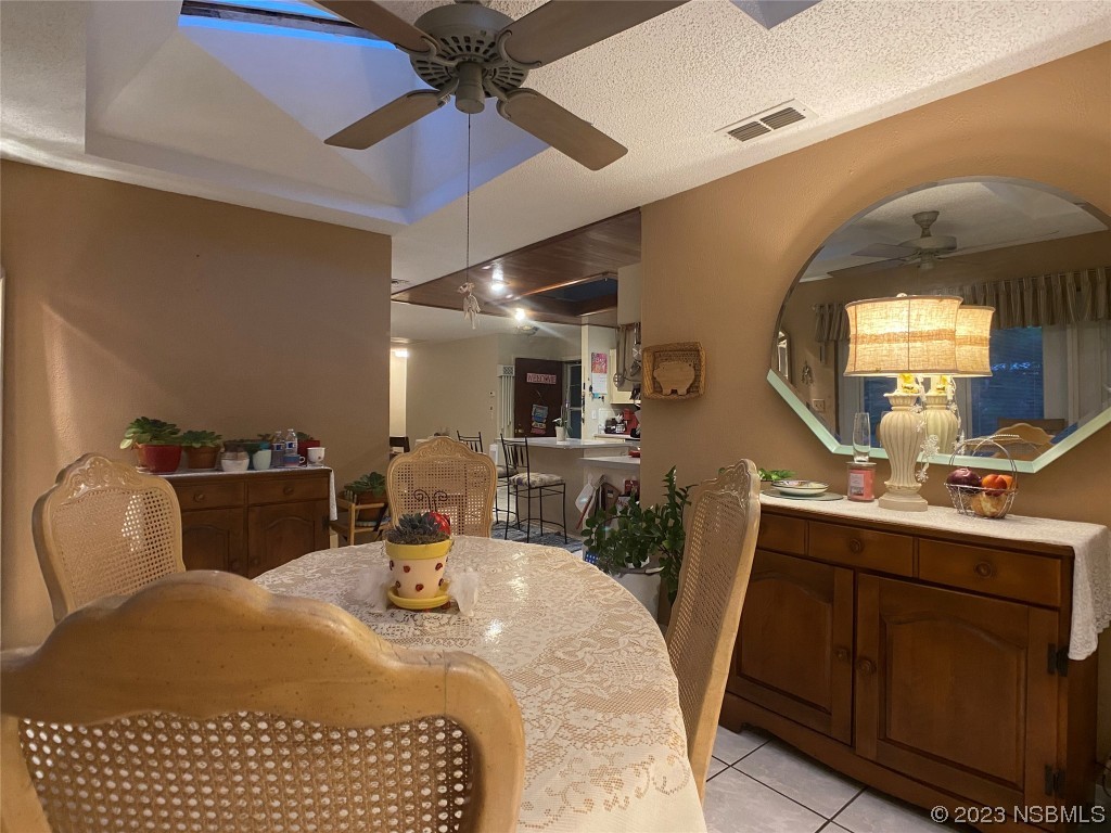 Undisclosed Address Casselberry, FL 32707 - Photo 9 of 19 a bedroom with a bed a mirror and lamp