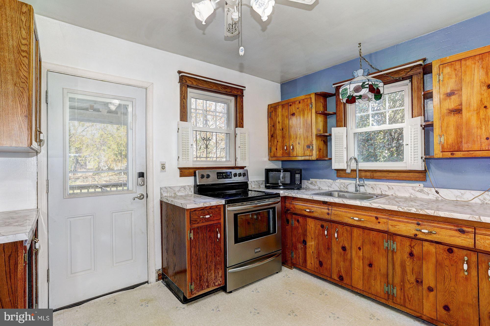1318 Elm Road Baltimore, MD 21227 - Photo 6 of 24 Kitchen | Access to Deck