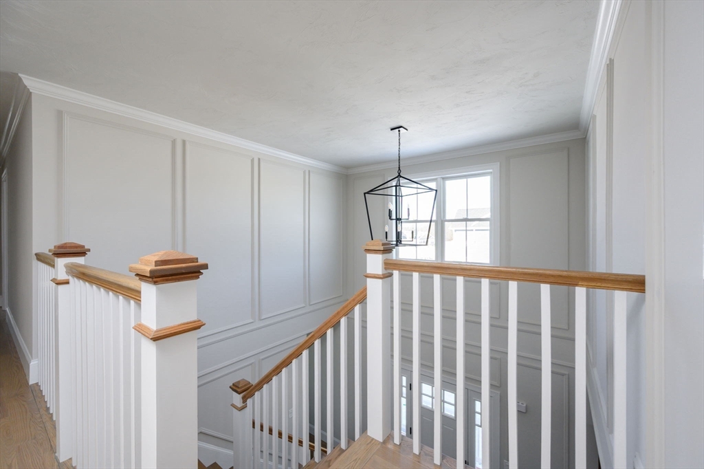 78 Metacomet Road, Unit 78 West Bridgewater, MA 02379 - Photo 25 of 39 a view of a hallway with windows