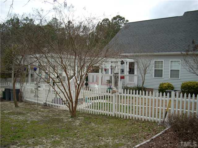 8125 Springwind Drive Willow Spring, NC 27592 - Photo 8 of 25 a view of a house with a fence