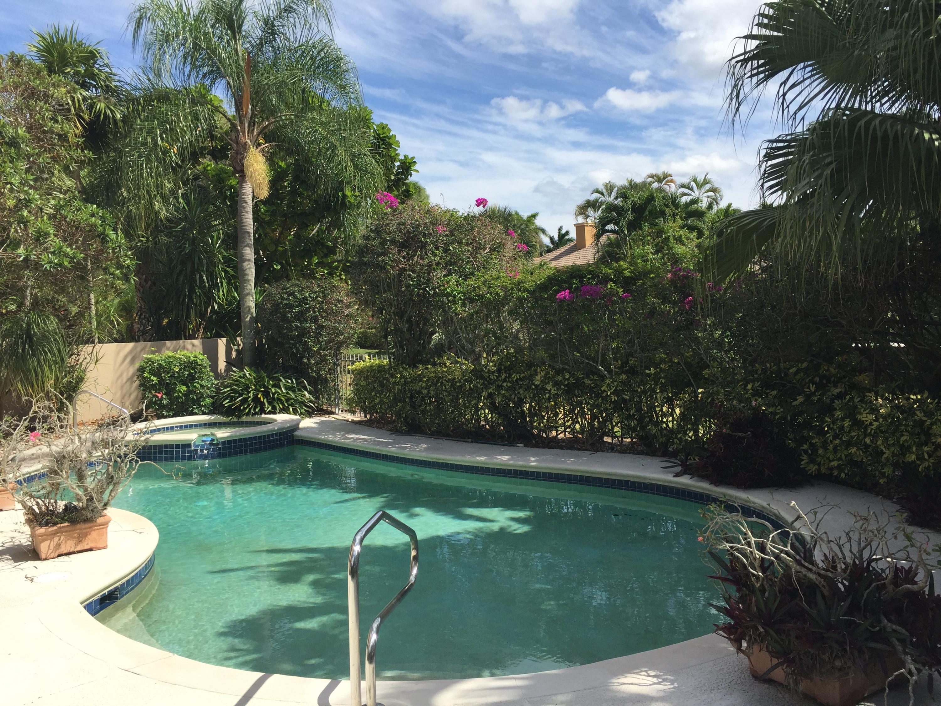 2226 Northwest 60th Street Boca Raton, FL 33496 - Photo 19 of 22 a view of a swimming pool with a patio