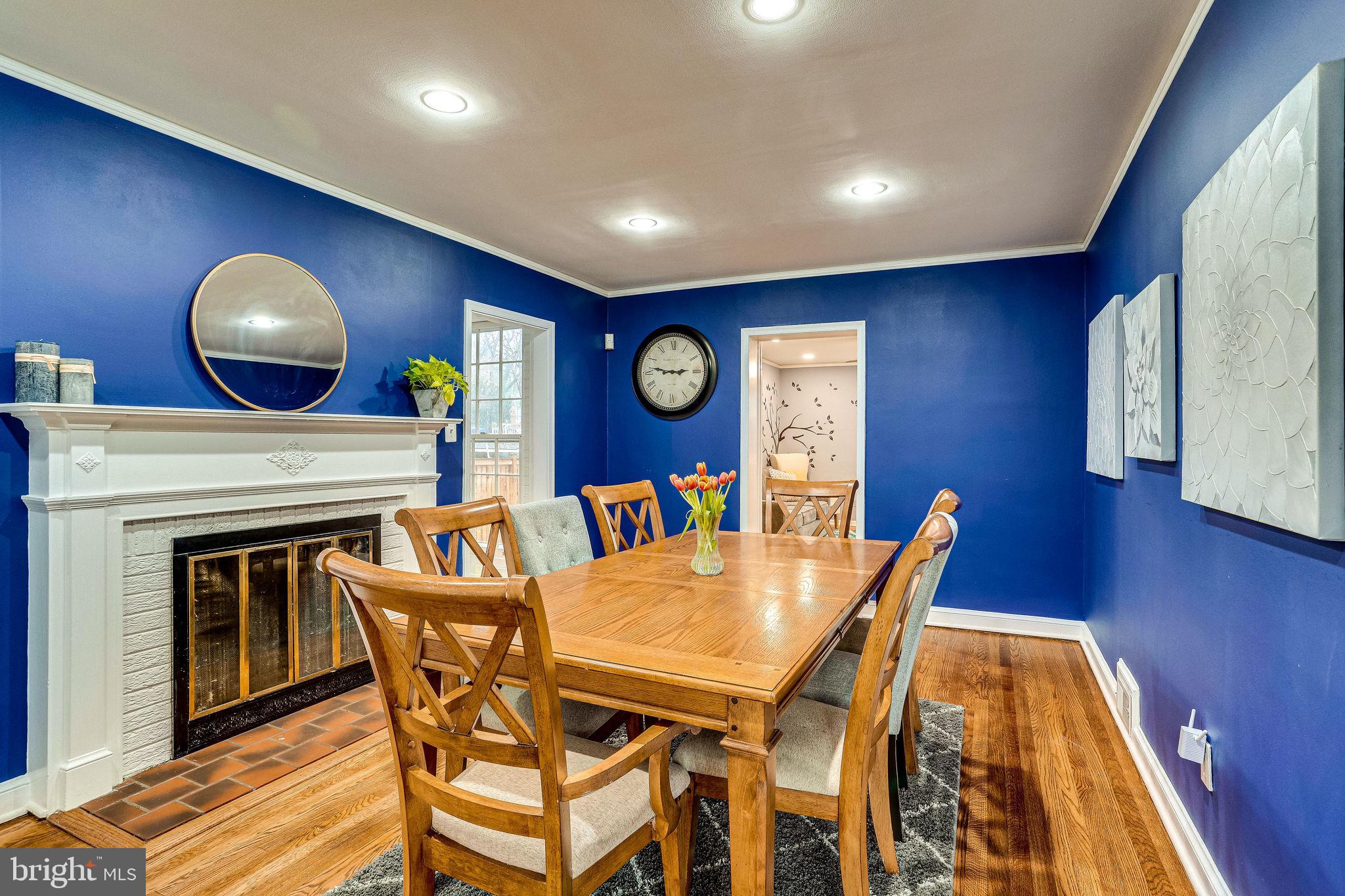 9907 Renfrew Road Silver Spring, MD 20901 - Photo 4 of 32 Separate dining room with wood burning fireplace