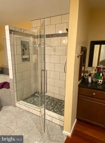 a view of walk in closet with clothes