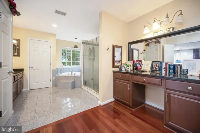 a bathroom with a sink a toilet and shower curtain