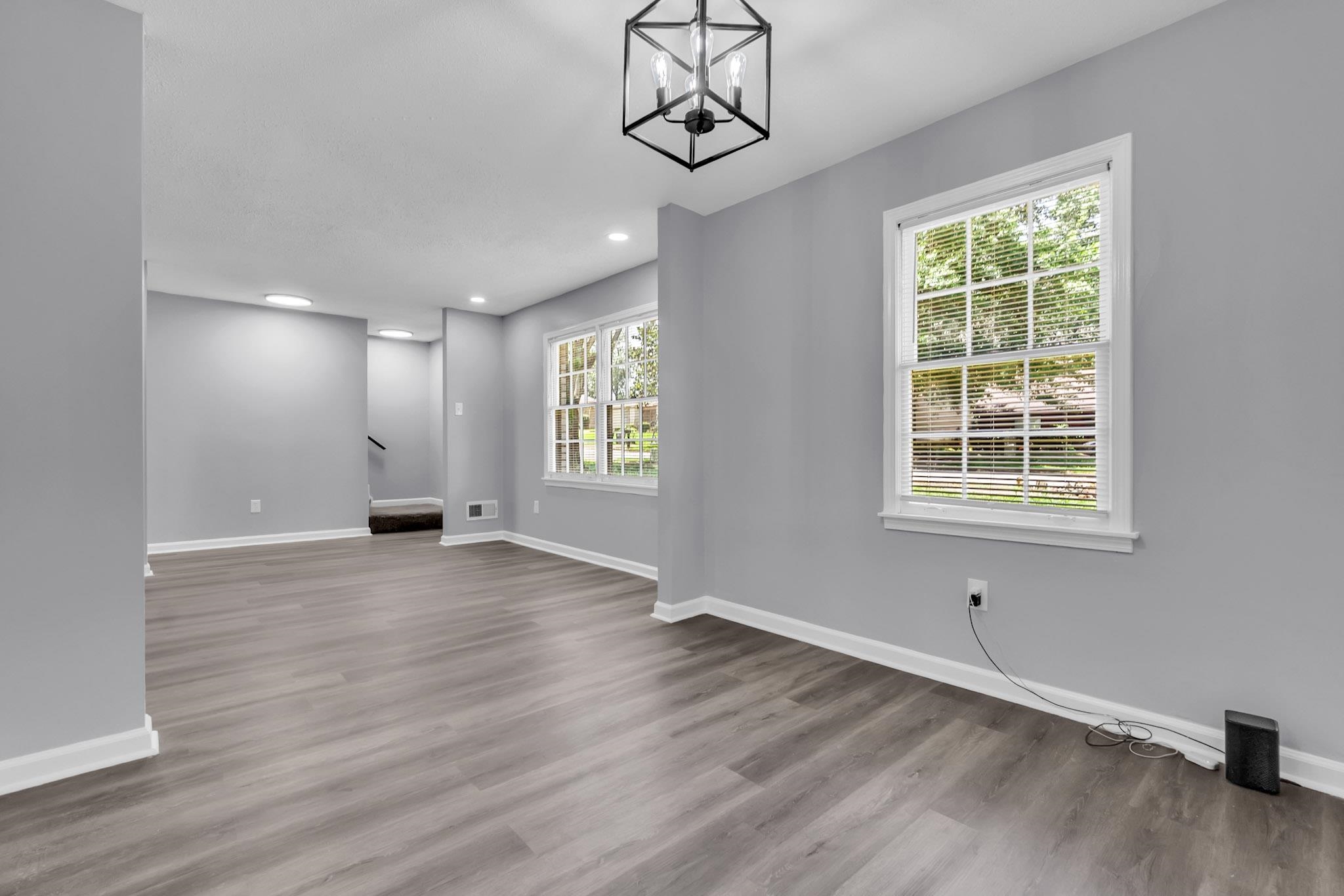 3314 Bright Ridge Cove Memphis, TN 38115 - Photo 4 of 16 Bright living space featuring wood-finish flooring, light gray walls, and white baseboards