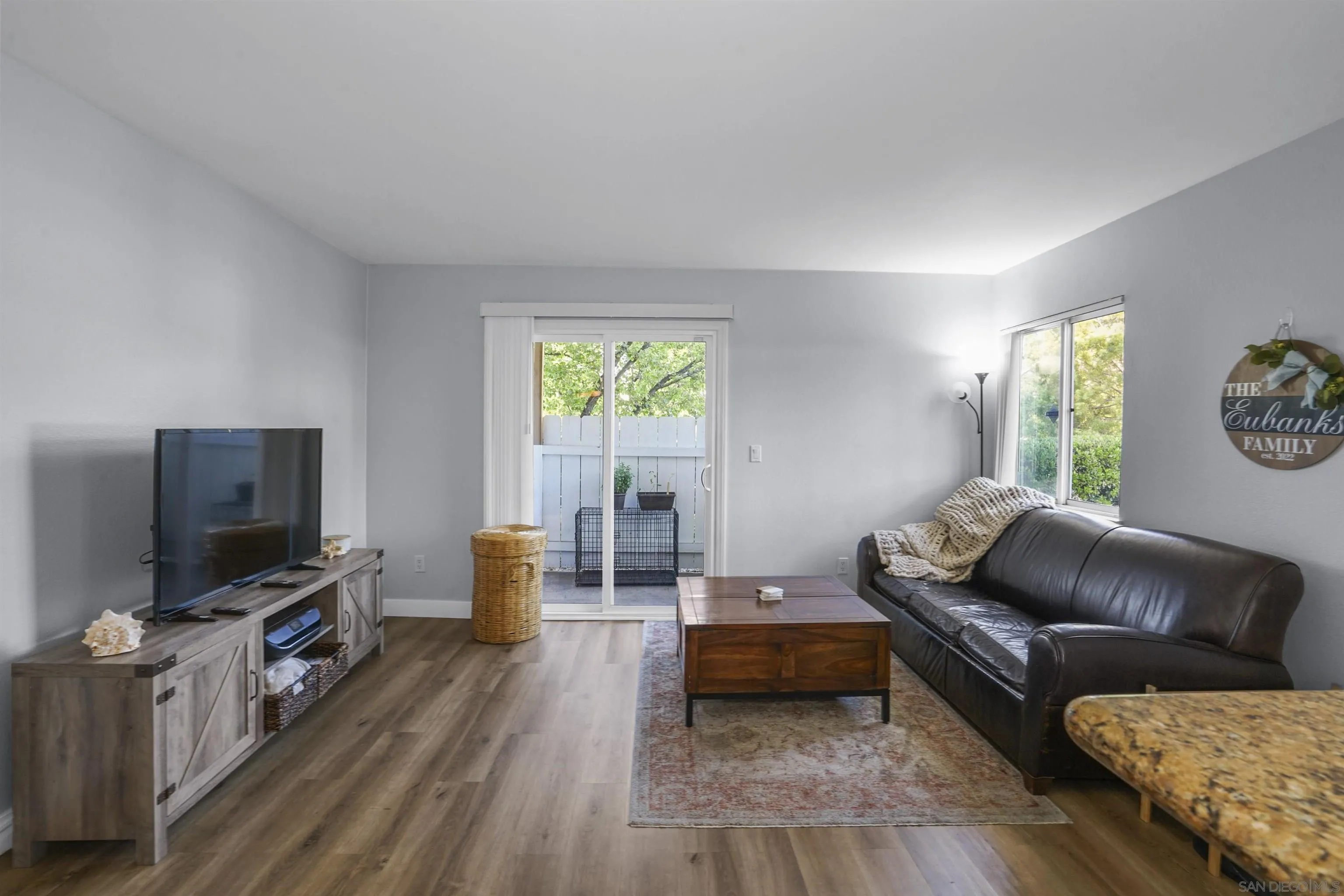 495 San Pasqual Valley Road, Unit 146 Escondido, CA 92025 - Photo 11 of 26 a living room with furniture and a flat screen tv