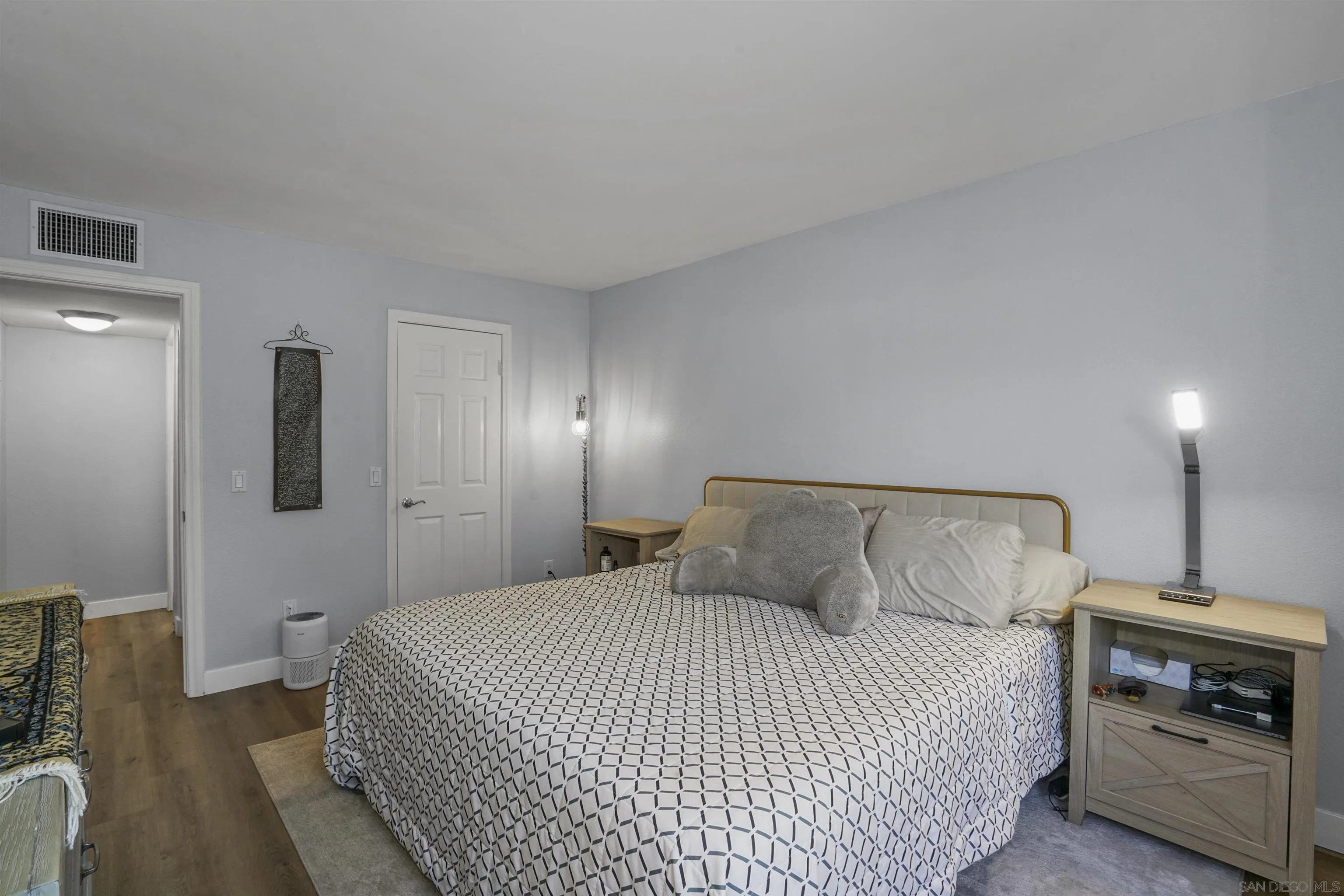 495 San Pasqual Valley Road, Unit 146 Escondido, CA 92025 - Photo 17 of 26 a bedroom with a bed and a fireplace