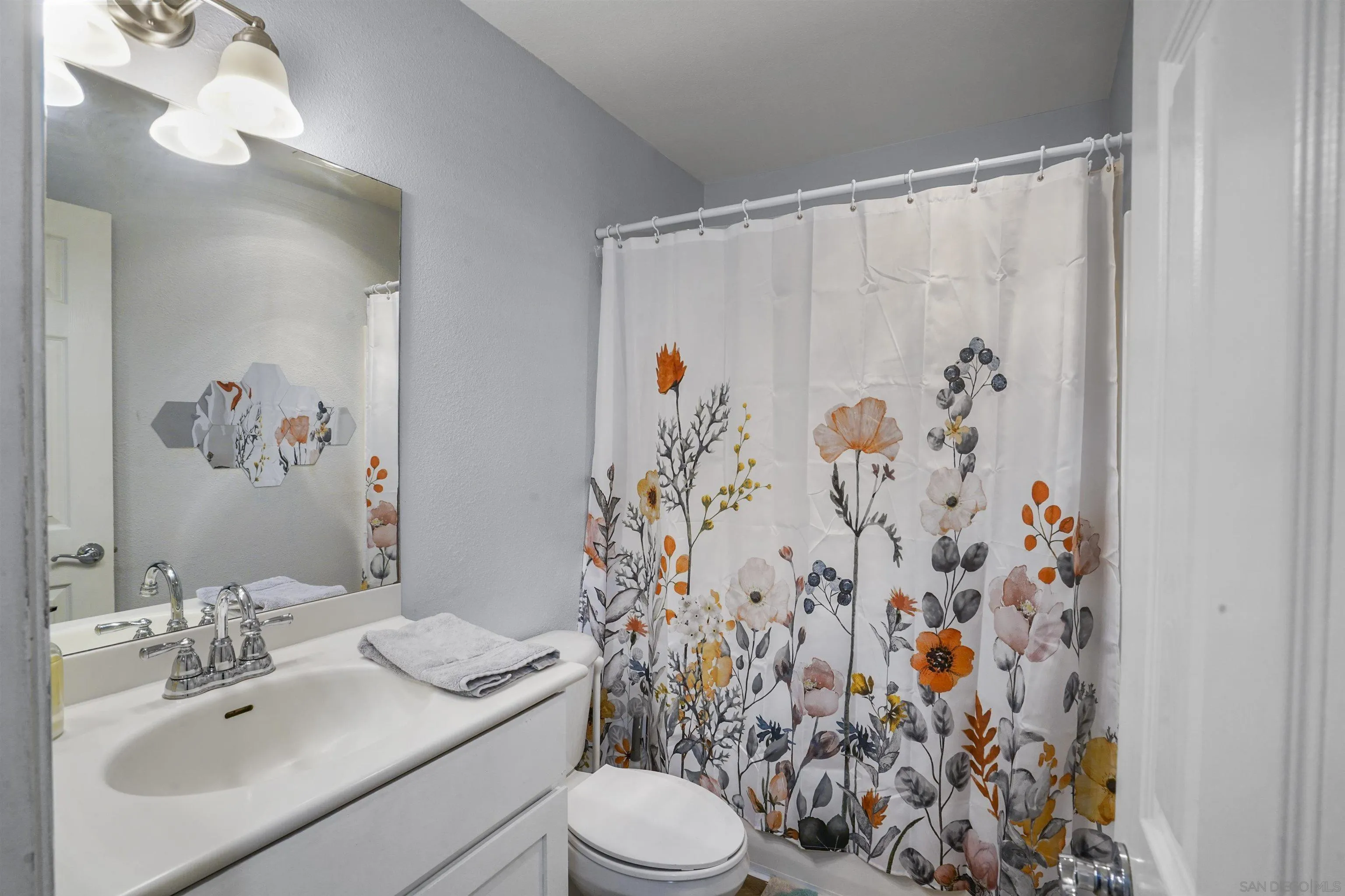495 San Pasqual Valley Road, Unit 146 Escondido, CA 92025 - Photo 18 of 26 a bathroom with a sink toilet and shower