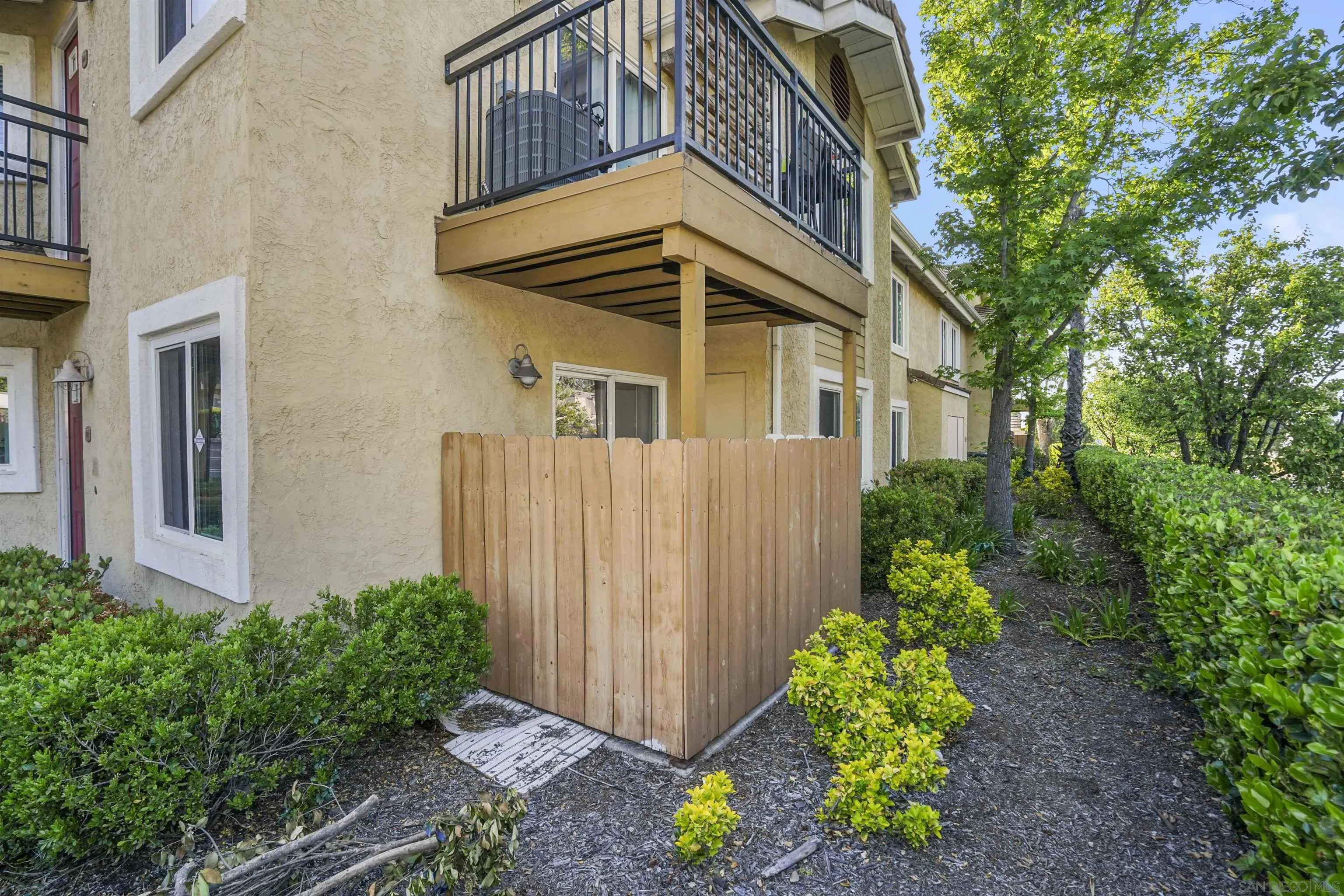 495 San Pasqual Valley Road, Unit 146 Escondido, CA 92025 - Photo 20 of 26 a view of a house with backyard and garden