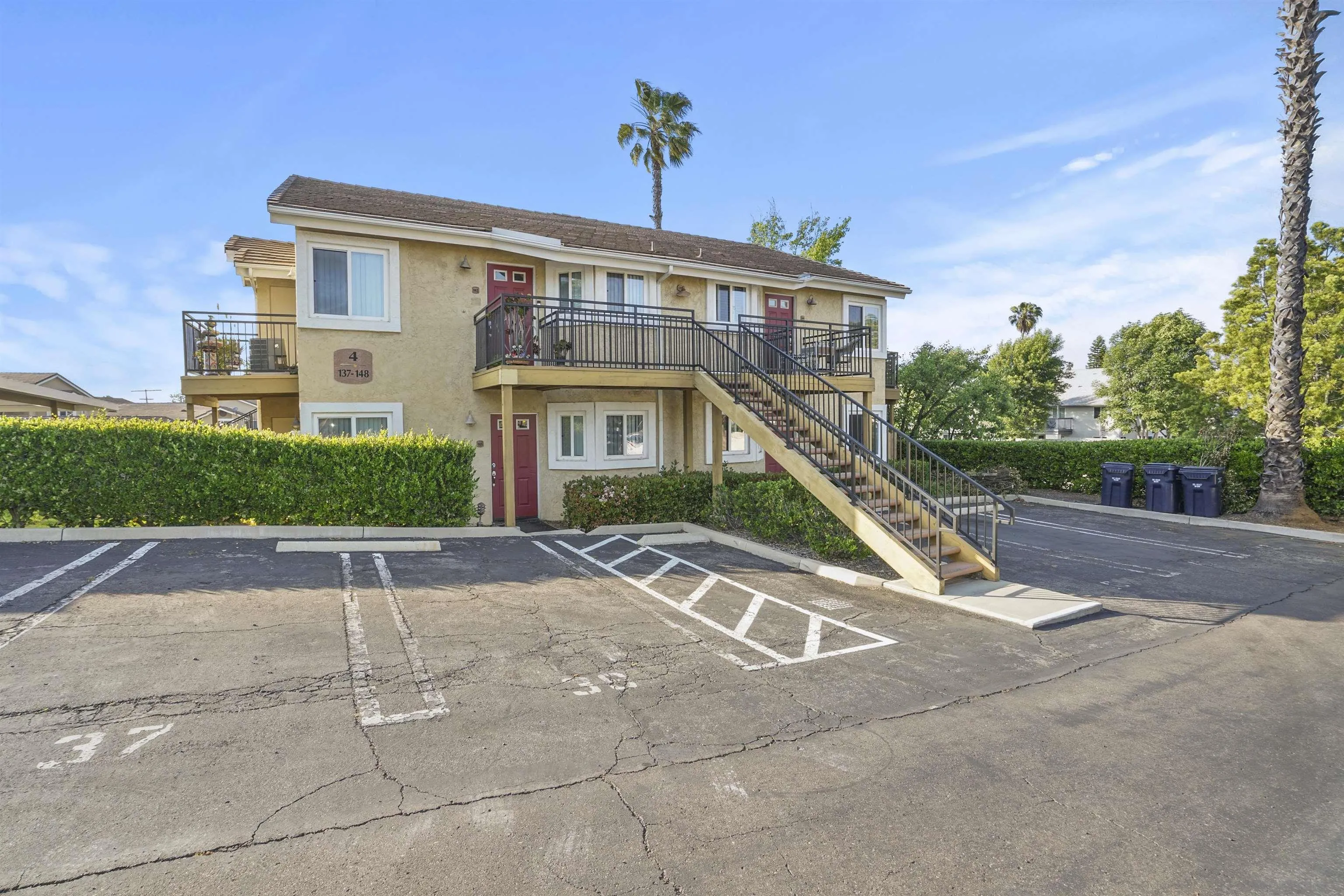 495 San Pasqual Valley Road, Unit 146 Escondido, CA 92025 - Photo 2 of 26 a front view of a house with a yard