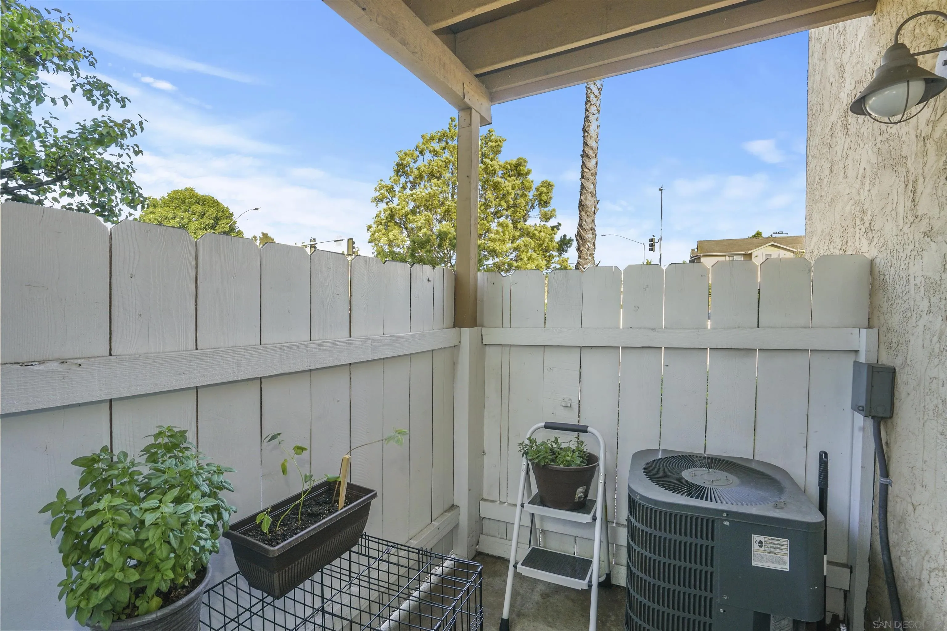 495 San Pasqual Valley Road, Unit 146 Escondido, CA 92025 - Photo 21 of 26 a view of table and chair in patio