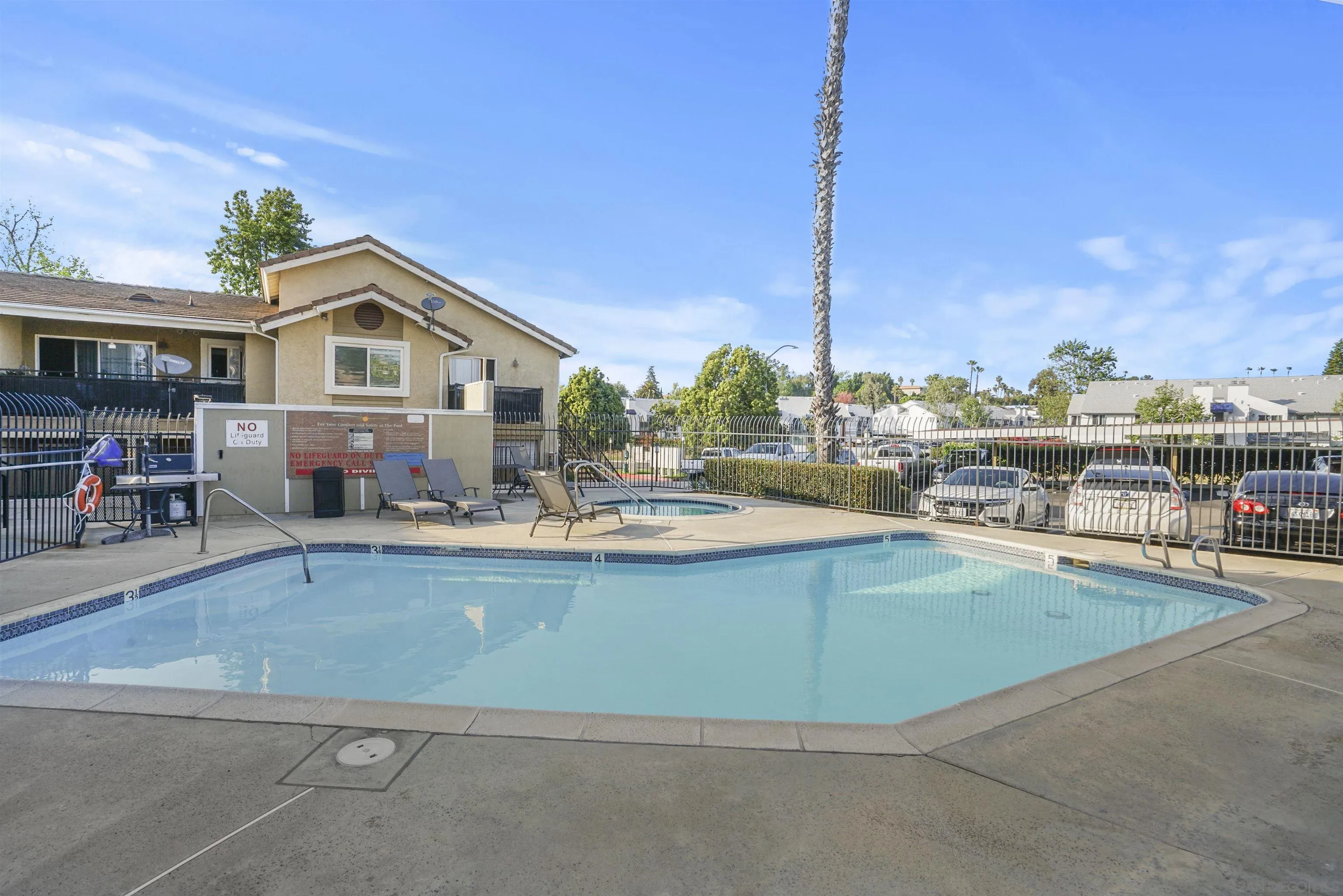 495 San Pasqual Valley Road, Unit 146 Escondido, CA 92025 - Photo 25 of 26 a view of a house with pool and chairs