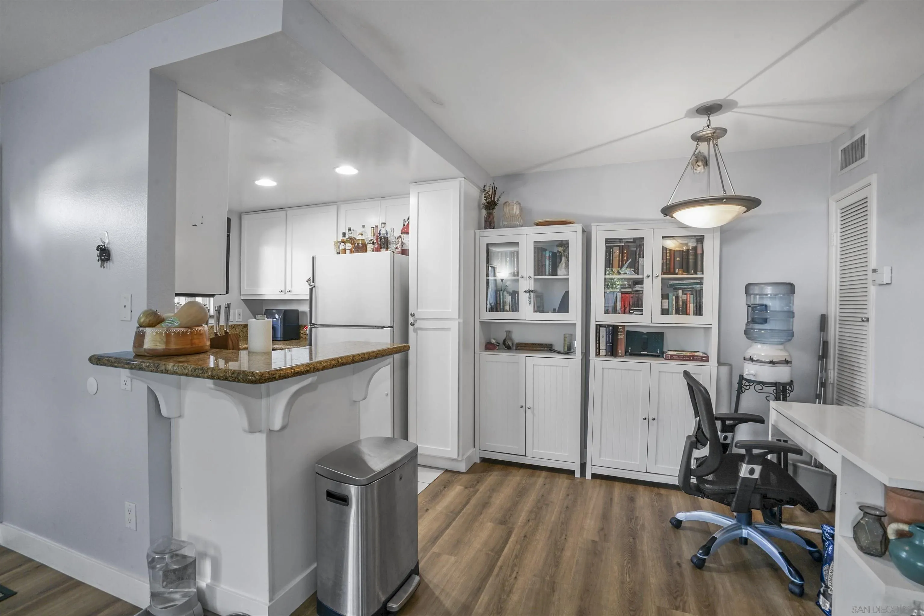 495 San Pasqual Valley Road, Unit 146 Escondido, CA 92025 - Photo 9 of 26 a kitchen with stainless steel appliances granite countertop a sink refrigerator and cabinets