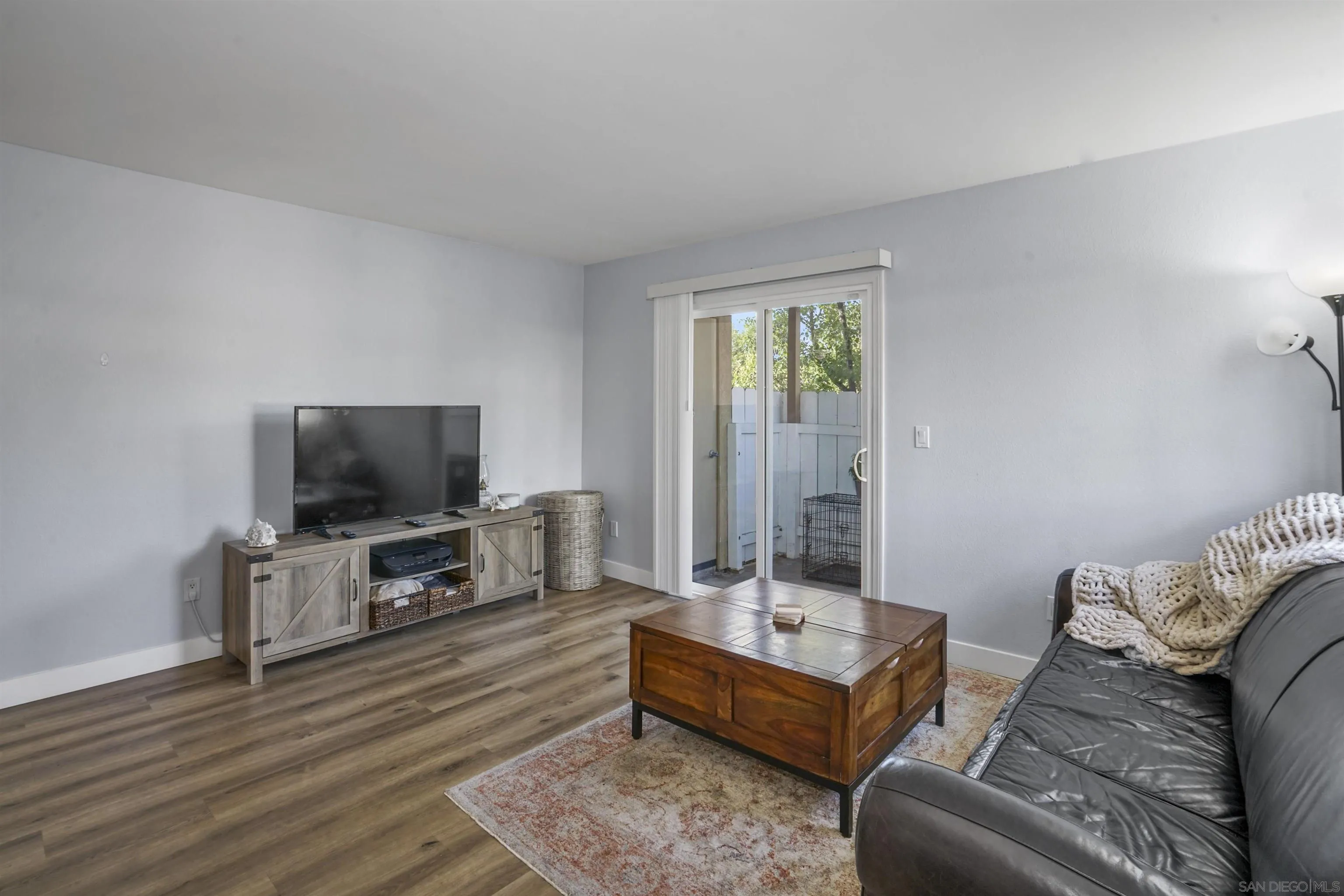 495 San Pasqual Valley Road, Unit 146 Escondido, CA 92025 - Photo 10 of 26 a living room with furniture and a flat screen tv