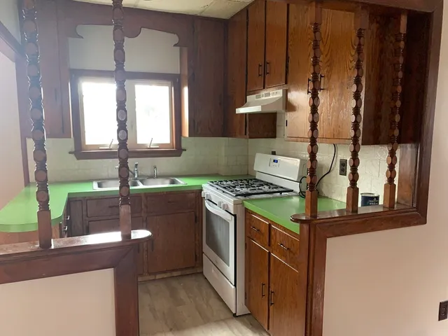 a kitchen with a stove and a sink