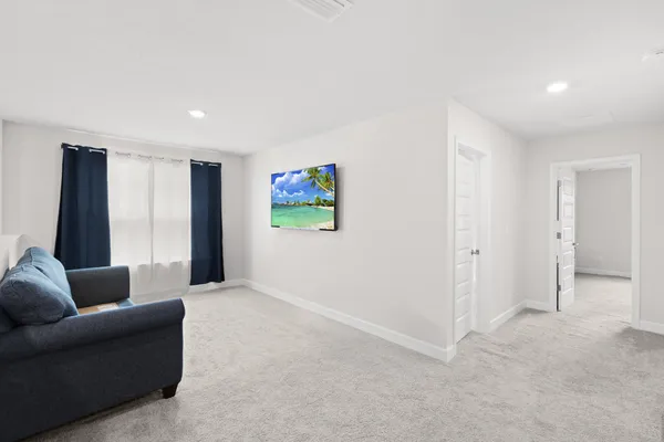 an aerial view of a house with a garden and swimming pool