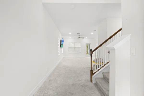 a kitchen with stainless steel appliances granite countertop a sink refrigerator and cabinets