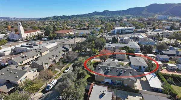 an aerial view of a house with a garden