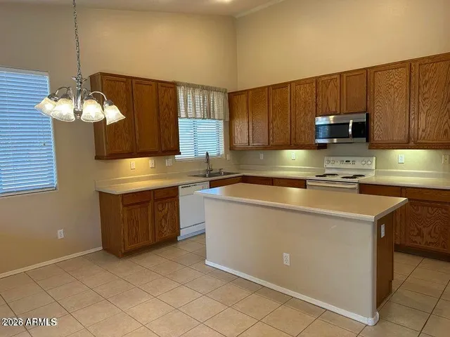 a kitchen with cabinets a sink and a stove