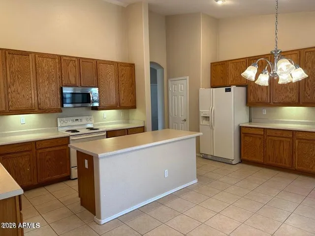 a kitchen with a cabinets and a stove top oven
