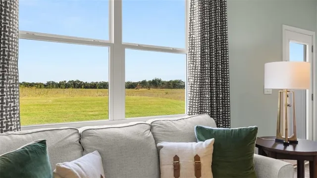 a balcony with table and chairs