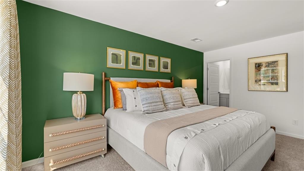 123 Kenmore Circle Perry, GA 31069 - Photo 34 of 48 a bedroom with a bed and a lamp on table