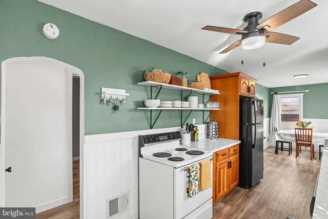 a kitchen that has a stove and a table