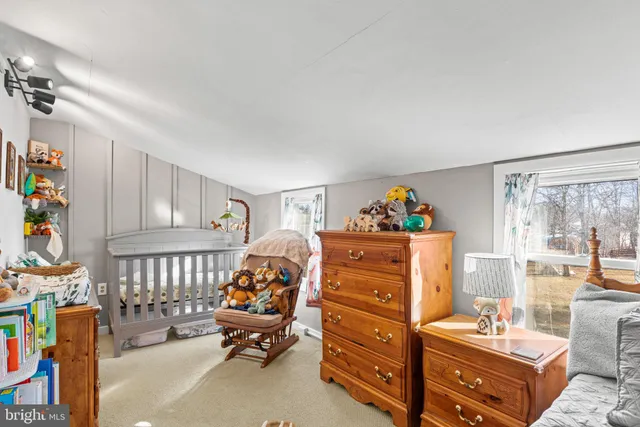 a bedroom with furniture and a window