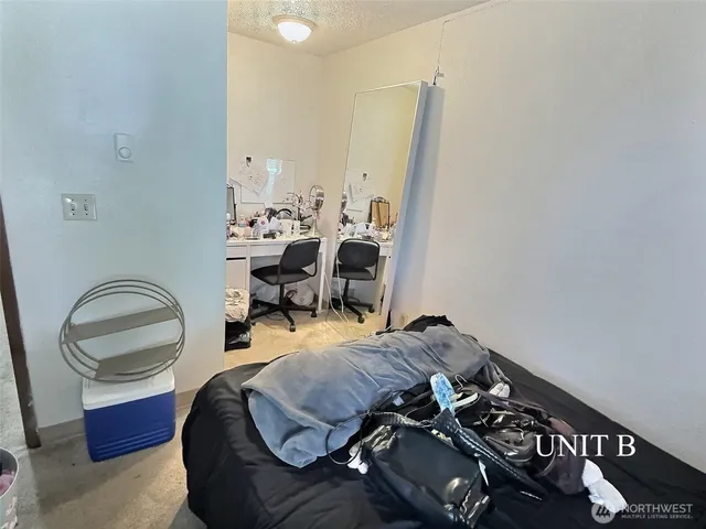 a bedroom with bed and a window