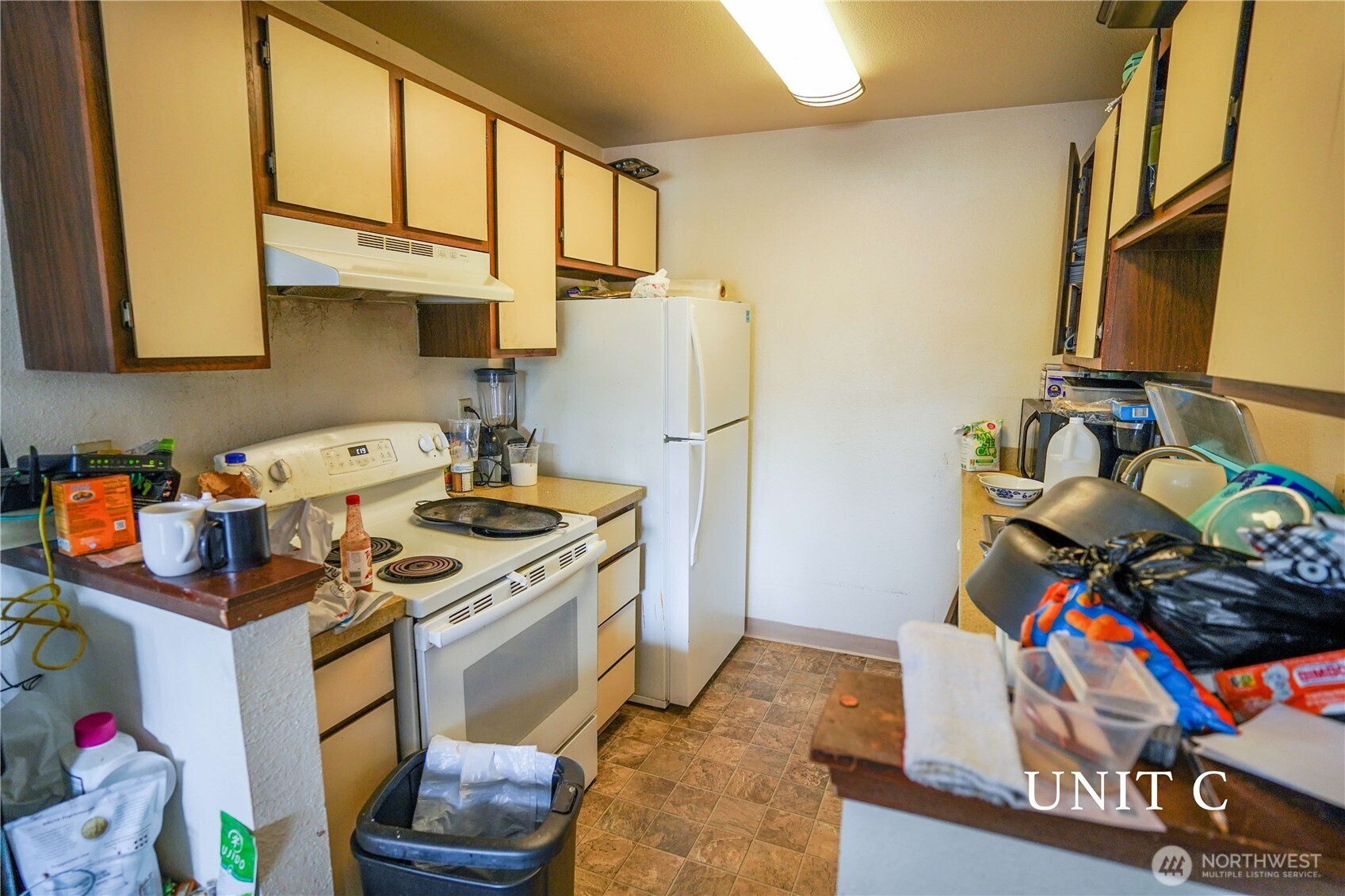 115 South 339th Circle Federal Way, WA 98003 - Photo 22 of 35 a kitchen with stainless steel appliances granite countertop a sink stove and refrigerator