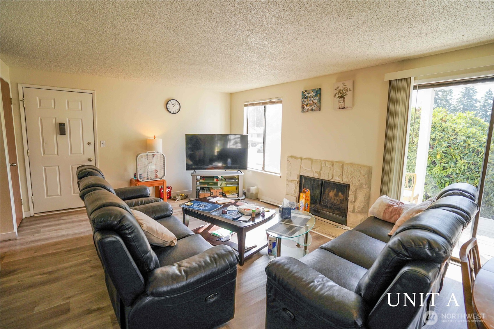115 South 339th Circle Federal Way, WA 98003 - Photo 8 of 35 a living room with furniture fireplace and a large window