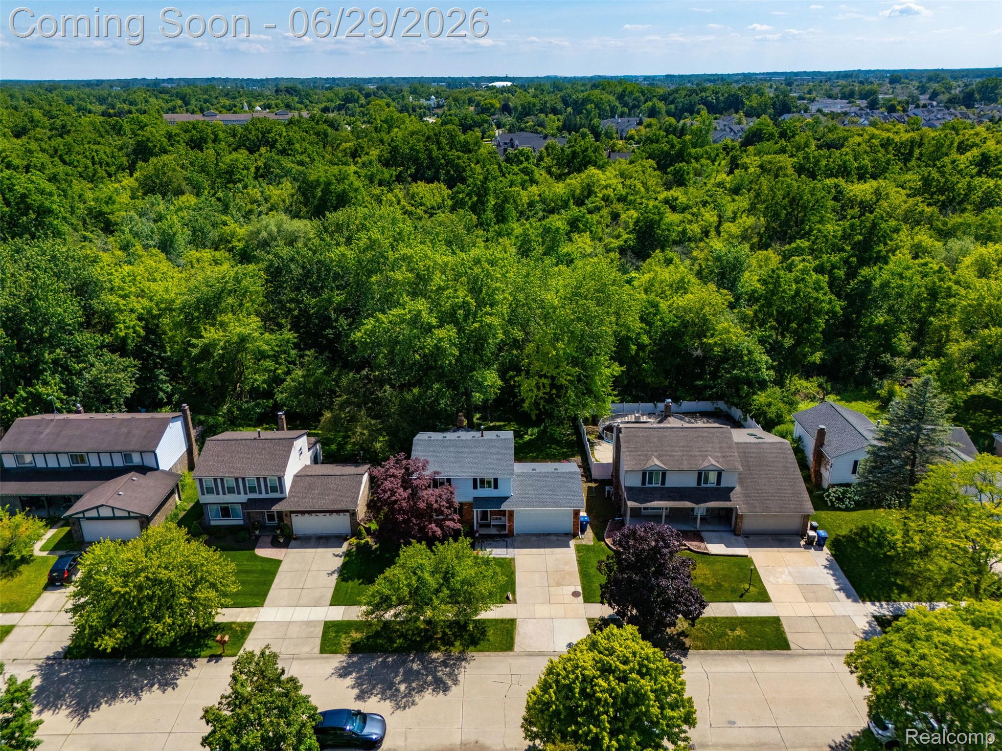 45179 Rudgate Road Canton, MI 48188 - Photo 34 of 48 Aerial perspective showcasing a residential street with five distinct properties