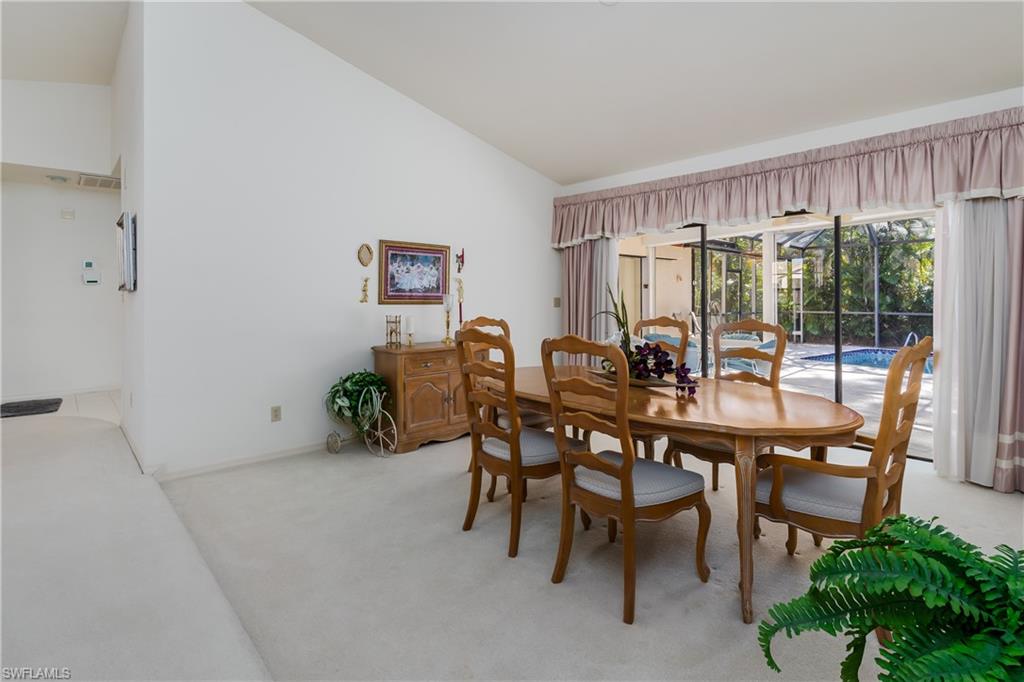 1502 Foxfire Lane Naples, FL 34104 - Photo 18 of 49 a dining room with furniture and window