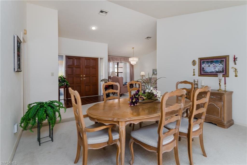 1502 Foxfire Lane Naples, FL 34104 - Photo 19 of 49 a view of a dining room with furniture