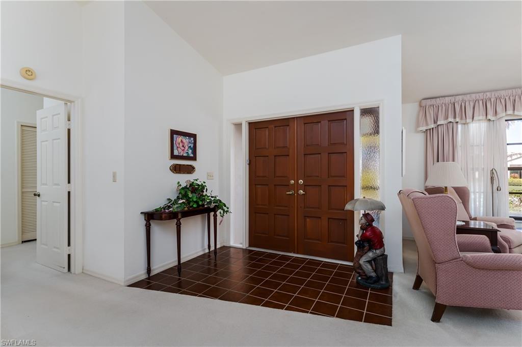1502 Foxfire Lane Naples, FL 34104 - Photo 23 of 49 a living room with furniture