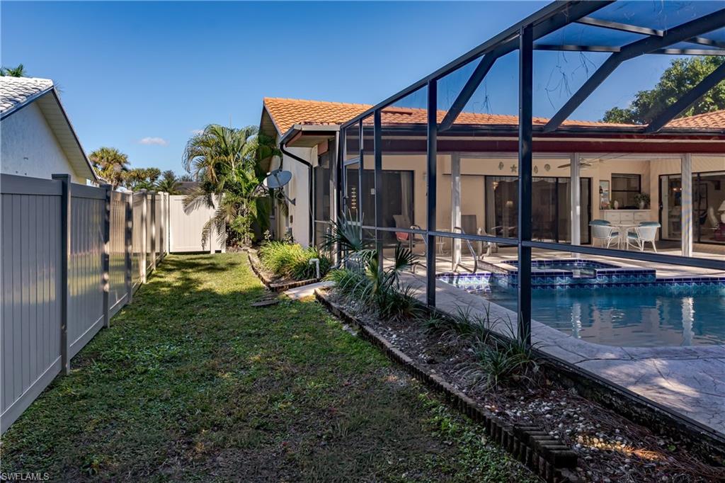 1502 Foxfire Lane Naples, FL 34104 - Photo 37 of 49 a view of a house with backyard and sitting area