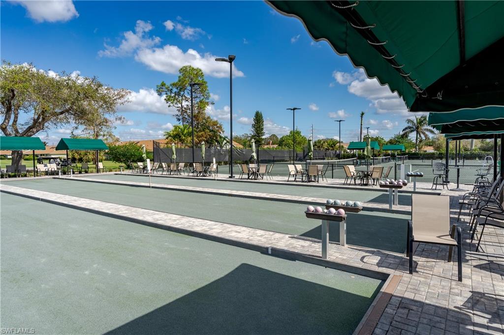 1502 Foxfire Lane Naples, FL 34104 - Photo 41 of 49 a view of a swimming pool with outdoor seating
