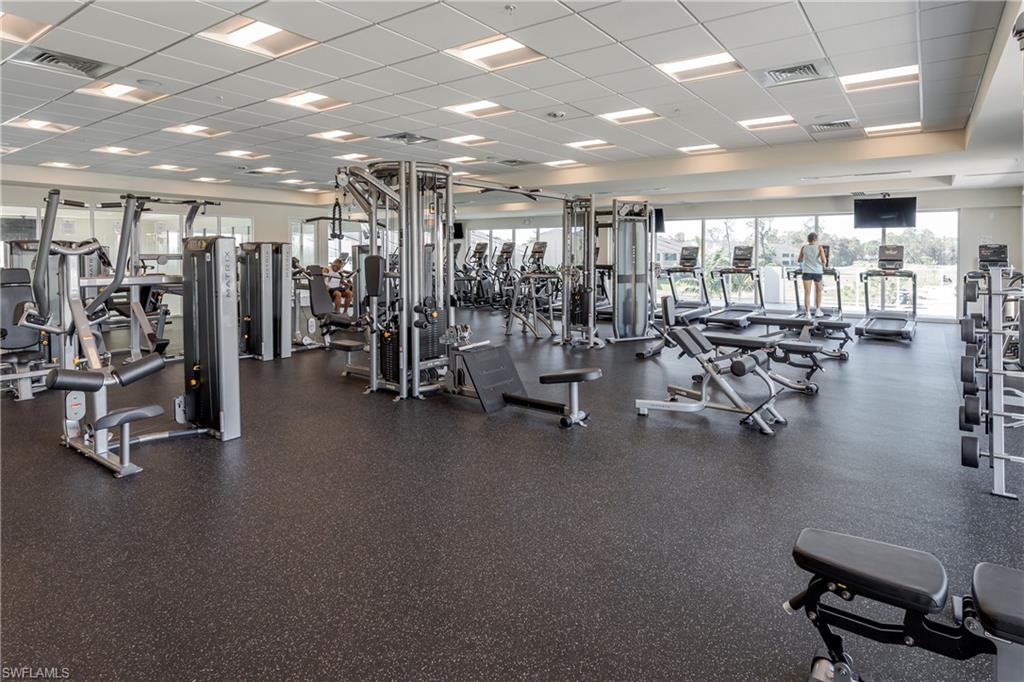 1502 Foxfire Lane Naples, FL 34104 - Photo 42 of 49 a view of a room with gym equipment