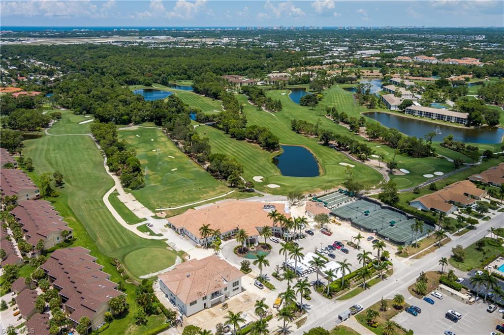 1502 Foxfire Lane Naples, FL 34104 - Photo 47 of 49 an aerial view of a house with a yard