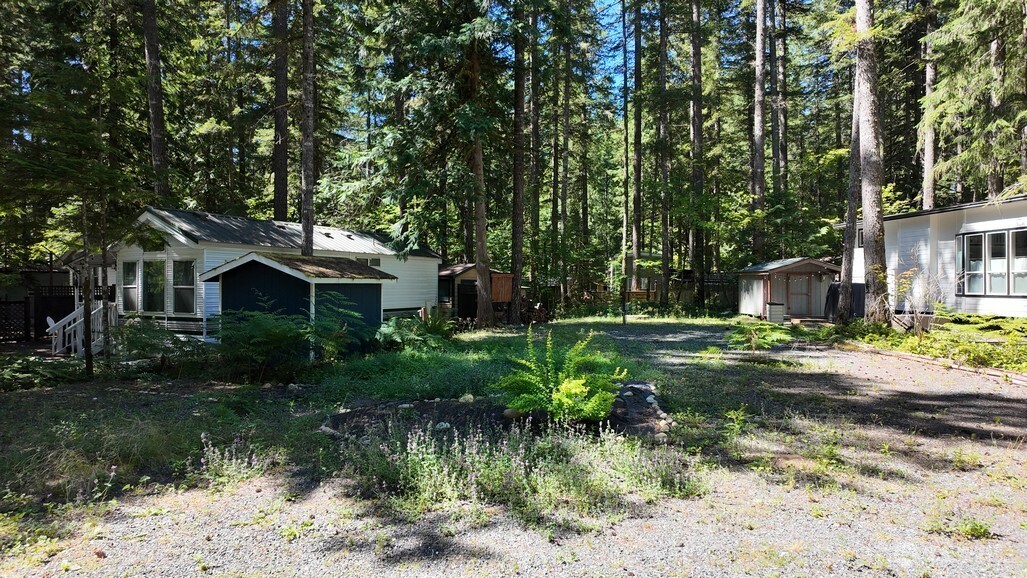 82 Riverside Drive Deming, WA 98244 - Photo 14 of 33 a front view of a house with a yard