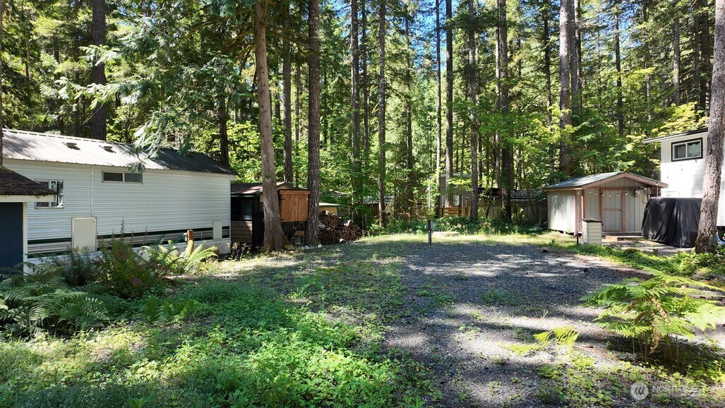 82 Riverside Drive Deming, WA 98244 - Photo 16 of 33 a view of a barn in the middle of a yard