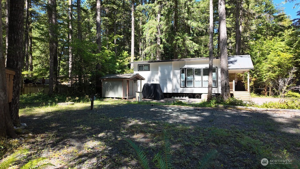 82 Riverside Drive Deming, WA 98244 - Photo 17 of 33 a view of a house with a yard and large tree
