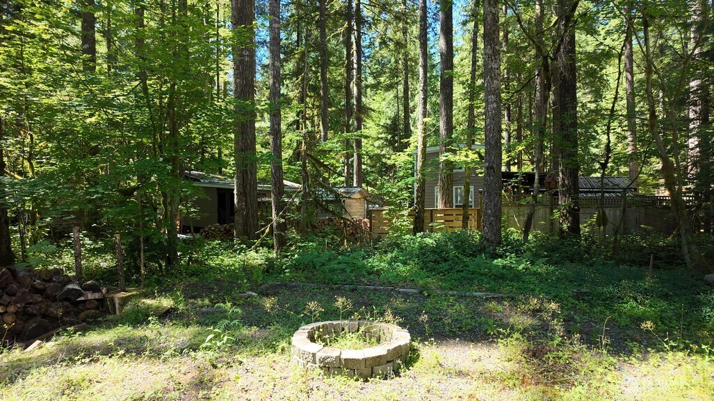 82 Riverside Drive Deming, WA 98244 - Photo 7 of 33 a view of a lake with a house