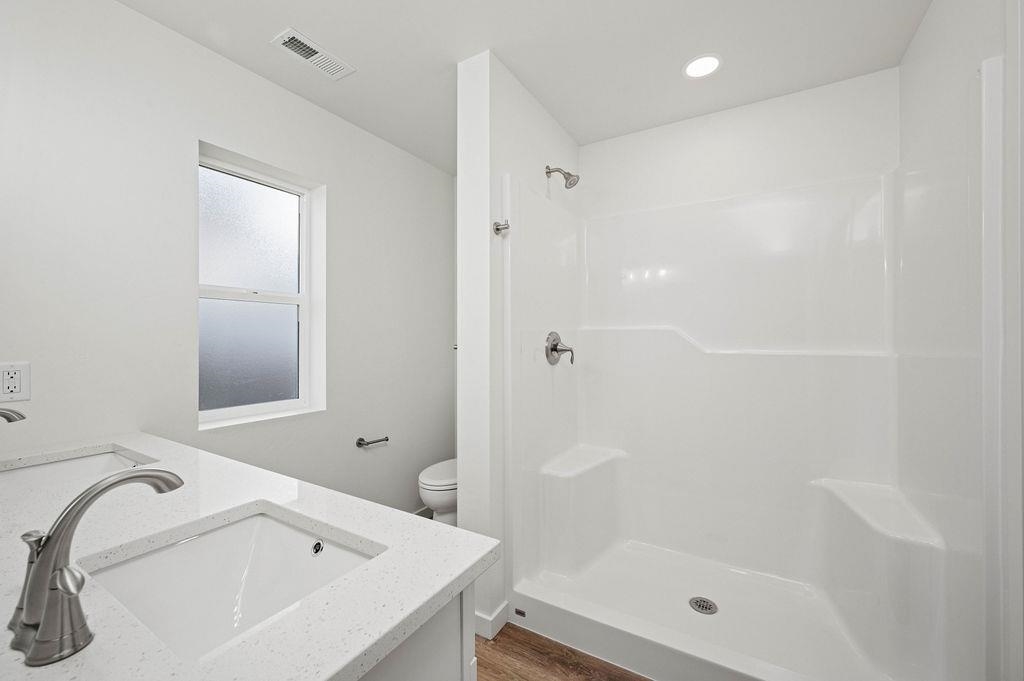 166 Orchard View Way Grand Junction, CO 81503 - Photo 12 of 20 a white bath tub sitting next to a shower