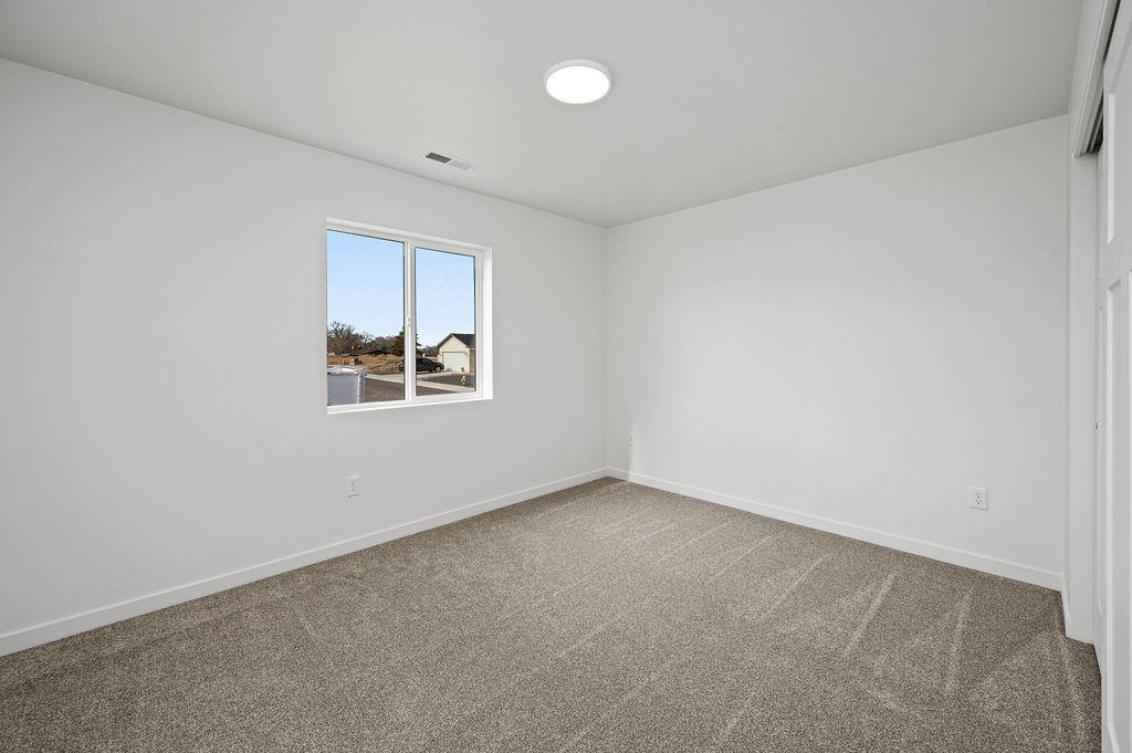 166 Orchard View Way Grand Junction, CO 81503 - Photo 15 of 20 an empty room with windows and ceiling fan