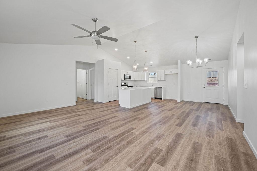 166 Orchard View Way Grand Junction, CO 81503 - Photo 2 of 20 a view of a kitchen with a sink dishwasher a refrigerator with wooden floor